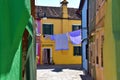 hidden part of Burano Island, Venice. Colored houses and clothes hanged to dry.