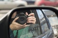 Hidden photographing. Reflection in car mirror Royalty Free Stock Photo