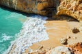Hidden among rocks sandy beach, Algarve, Portugal Royalty Free Stock Photo