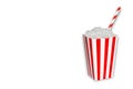 Hidden sugar in food and soft drinks, beverages, a popcorn box full of sugar cristal cubes with a straw on white background with