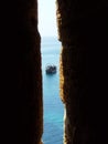 A hidden view from a high fortress on a lonely ship on the open sea