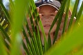 Hidding behind the green leaves