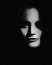 Hiden in the shadows. Horror movie style female portrait Royalty Free Stock Photo