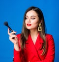 Hiding all imperfections. Attractive woman applying makeup brush. Perfect skin tone. Makeup artist concept. Looking good Royalty Free Stock Photo