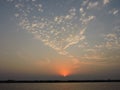 Hidrovia Paraguay ParanÃÂ¡ rayos sol entre las nubes. Sunset at de water way Paraguay Parana