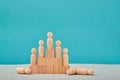 Hierarchy system in company. Cooperation and collaboration. Team competition. Subordination. Pyramid with wooden people Royalty Free Stock Photo