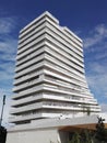 Hieratic building, immaculate white, rising into a blue sky Royalty Free Stock Photo