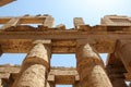 Hieroglyphs and ancient symbols on the columns of the Temple of Karnak, landmark of Egypt in Luxor Royalty Free Stock Photo