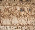 Hieroglyphic carving painting on an ancient egyptian temple wall Royalty Free Stock Photo