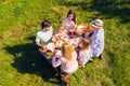 High above angle view big full family having picnic cheerful on holidays spending time together enjoying sunny day Royalty Free Stock Photo