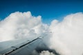 High above the clouds, the sky viewed from inside the airplane - wing view perspective Royalty Free Stock Photo