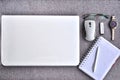 High above view of office workplace with laptop and mouse with paper, pen ,eyeglasses, usb stick, watch on grey desk Royalty Free Stock Photo