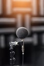 High accuracy microphone in noise sound testing room with LED light bokeh. High technology. Microphone for noise recorder. Royalty Free Stock Photo