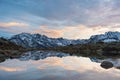 High altitude alpine lake, reflections at sunset Royalty Free Stock Photo