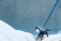 High-altitude climber. The profession of working at height Royalty Free Stock Photo