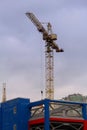 High Altitude Crane Works Over Concrete Building Frame Under Constructionn Royalty Free Stock Photo