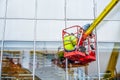 High-altitude installation works.  Professional installation work on a telescopic boom lift platform. Royalty Free Stock Photo