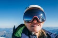 High altitude mountaineer smiling female portrait in safe ski helmet and goggles on the Mont Blanc 4810m with picturesque Alpine