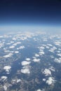 High altitude view of fluffy clouds sky and earth