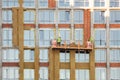 High-altitude work on the external walls of high-rise building. Glass wool insulation.