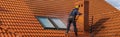 High-altitude worker washing the roof with pressurized water Royalty Free Stock Photo