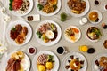High angel shot of full breakfast table with omelets, potatoes, and vegetables Royalty Free Stock Photo