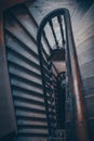 High angle above view down of old vintage staircase winding spiral in Lviv, Ukraine, Europe with nobody architecture dark low-key Royalty Free Stock Photo