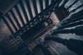 High angle above view down of old vintage staircase winding spiral in Lviv, Ukraine, Europe with nobody architecture dark low-key Royalty Free Stock Photo
