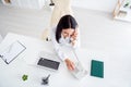 High angle above view photo of beautiful doctor lady speak telephone consulting patient assistant operator call center Royalty Free Stock Photo