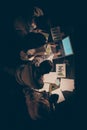 High angle above view vertical photo of four busy hard-working business people working overtime late evening study Royalty Free Stock Photo