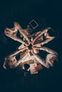 High angle above view vertical photo of four people business colleagues sitting table working late night holding pile Royalty Free Stock Photo