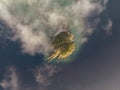 High angle aerial drone view of Arkhurst Island, a small islet next to Hayman Island in the Whitsunday Islands Group