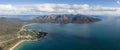 High angle aerial drone view of Coles Bay with Richardsons Beach and Hazards Mountain range Royalty Free Stock Photo