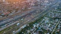 High angle aerial top down bird's eye view of many railroad train track and many cargo container train at big train station