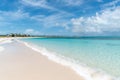 High-angle of a Bight sandy beach, water waves making foam, cloudy sky background Royalty Free Stock Photo