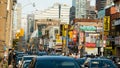 High-angle of a busy street of Chinatown with cars and cityscape background, Toronto Royalty Free Stock Photo