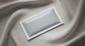 Blank Sachet Packaging on Luxurious Silk Fabric Royalty Free Stock Photo