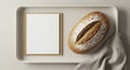 Rustic Loaf of Bread on a Light Gray Tray with Blank Paper Royalty Free Stock Photo