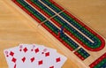 High angle closeup shot of playing cards and the board game cribbage Royalty Free Stock Photo