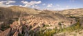 High angle colorful panoramic view of medieval ancient village of Albarracin among mountains with blue sky background Royalty Free Stock Photo