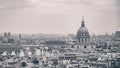 High angle grayscale shot of the view of Paris with the Pantheon and Notre Dame visible