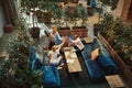 Smiling businesspeople high fiving together in an office lounge