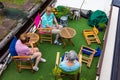 High angle of a group of older women sitting at Bridgewater Canal swing bridge at Barton