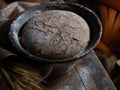 Wholegrain rye bread on rustic table in kitchen Royalty Free Stock Photo