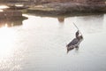 High-angle of a man canoeing on the river of Madagascar, light reflection in water Royalty Free Stock Photo