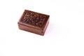 High angle mid close up of a brown wooden box on white background. Ayurvedic medicines concept Royalty Free Stock Photo