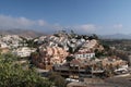 High-angle of Nerja view with houses and trees sunlit clear sky background Spain