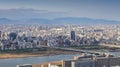 High angle panoramic view of Osaka city with Yodo river at sunset