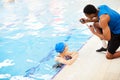 Woman Talking to Guard in Pool