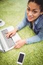 High angle portrait of businesswoman using laptop on carpet Royalty Free Stock Photo